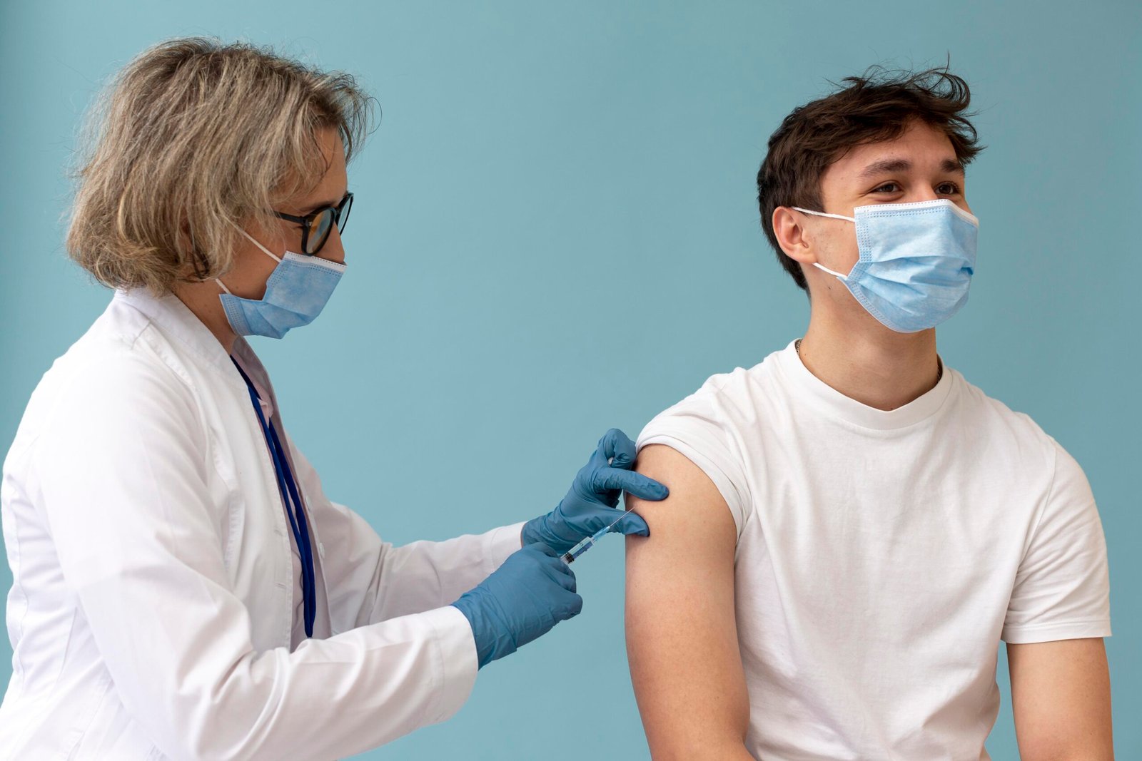 medium shot man getting Covid-19 vaccination